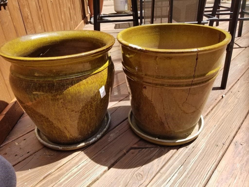 2 large green flower pots - one has a crack
