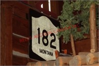 182 ROAD SIGN MONTANA ABOVE TRUCK