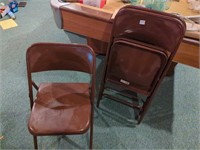 3 brown metal folding chairs