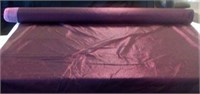 Roll of Burgundy metallic fabric