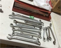 Assorted wrenches and red metal tray