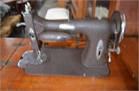 White Sewing Machine in Cabinet. Cord Has Been