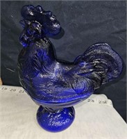 cobalt rooster on nest