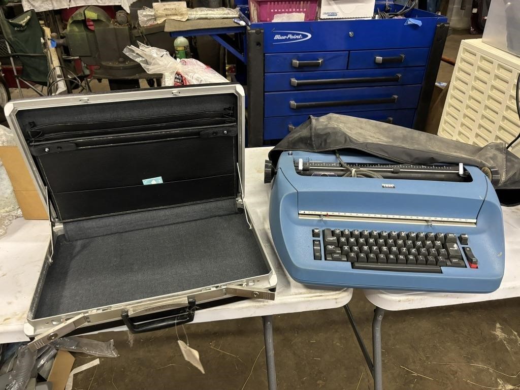 brief case and IBM selectric electric typewriter