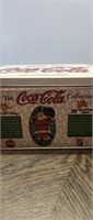 Coca Cola tin of metal art collectors cards