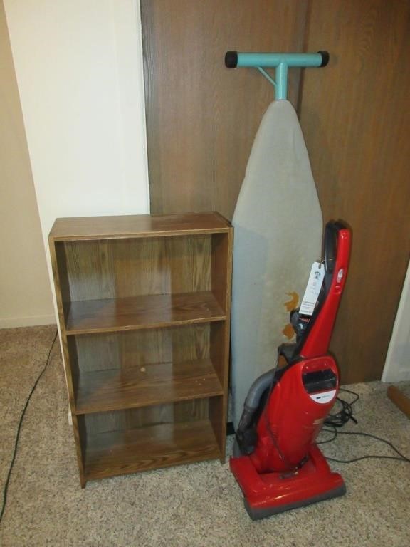 Kenmore vac, bookshelf, ironing board