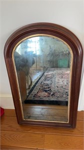Large antique walnut wall mirror, with a rounded