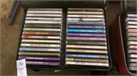 Two cases of CDs, older artists and country