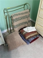 Quilt rack, afghan, & pillows on floor
