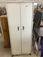 Metal pantry cabinet.  63 x 24 x 12