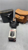 Vintage camera cases and film with visitation