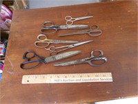 Seven Pairs of Scissors