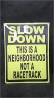 SLOW DOWN...NOT A RACETRACK 12" x 16" TIN SIGN