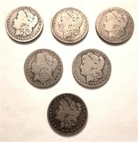 6 Morgan silver dollars worn