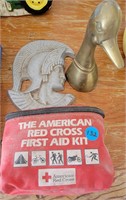 brass duck, aluminum knight and first aid kit
