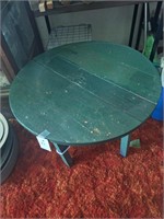 Small green table  16" high X  22" diameter