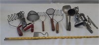Vintage kitchen utensils including red wood and