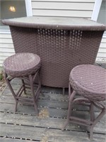 outdoor bar and 2 stools