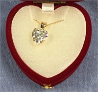 Gold toned necklace with cubic zirconium heart sha