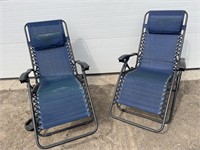 2 blue folding lawn chairs