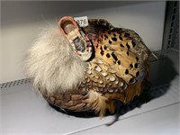 BASKET WITH FEATHERS & SMALL SHOE ON IT