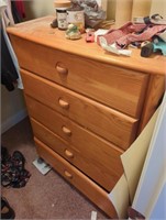 Natural wood Stanley chest of drawers in closet