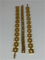 THREE GOLD TONE BRACELETS ONE WITH RHINESTONES