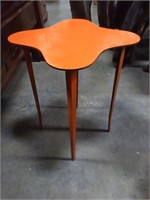 Orange solid metal table