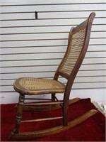 Vintage cane seat rocking chair.