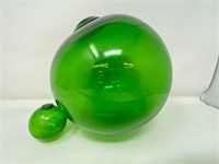 Two bright green glass fishing floats