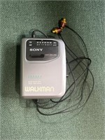 Grey Sony Walkman, auto shut off, anti rolling