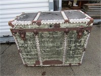 Antique trunk. On wheels.