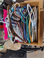 Box of hangers and gift bags