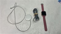 Apple Watch with charger and phone cable