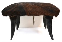 Handmade hide covered foot stool, horn feet