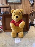 large plush Winnie the Pooh stuffed animal