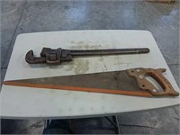 Hand saw and pipe wrench