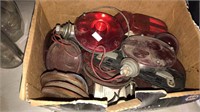 Box of vintage truck lights including lenses