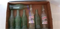 5 Old Mini Coke Bottles  And 2 Sun Rise Bottles.