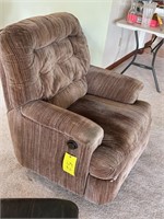 Padded over stuffed recliner showing some wear