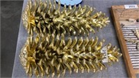 Two gold pinecones