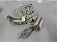 Duck decoys in a canvas carrying bag