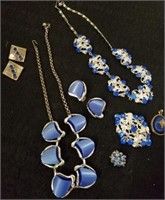 Group of vintage necklaces with earrings and pins
