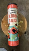 Auburn building bricks in canister