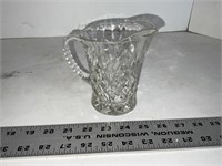 Small cut glass pitcher
