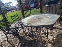 Patio table with 4 metal chairs.
