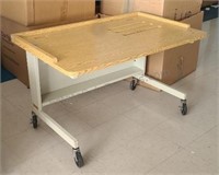 Steel computer desk with wood top. On casters
