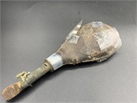 Old Powder horn made from a bull scrotum contains