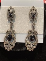 Pierced post earrings. Have stones that look like