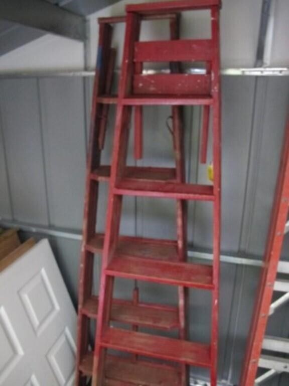 2 WOODEN SIX FOOT LADDERS   BOTH RED IN COLOR